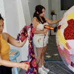 Lorraine Ustaris & Magdalena Johnson working on the 6-foot ball to be transformed into a disco ball. (GIH | Rasheed Ajamu)