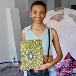 Lishele Liyuwork holding her piece for the art show at Imperfect Gallery. (GIH | Rasheed Ajamu)